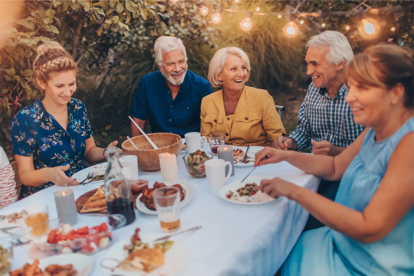 The Role of Trust Administration and Asset Protection Trusts in Modern Estate Planning Generational family dining together outdoors and discussing long-term goals.